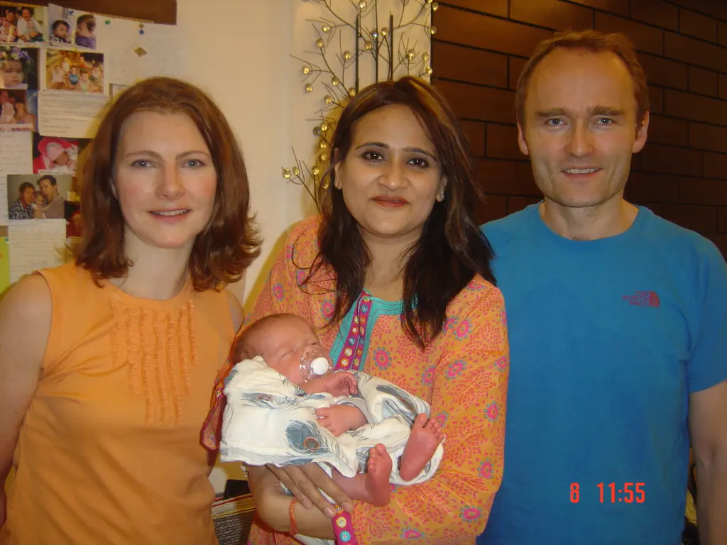 IVF success story – happy parents with newborn baby.