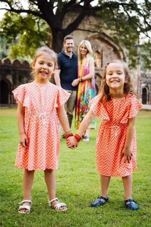 IVF success story – happy twin girls with parents.